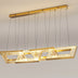 Gold geometric linear chandelier with LED panels suspended from ceiling against white background.