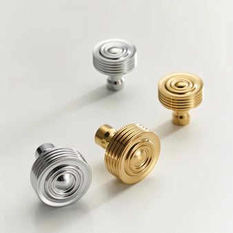 "Lifestyle image showcasing brass knobs with concentric ring designs and ridged surfaces in various metallic finishes."