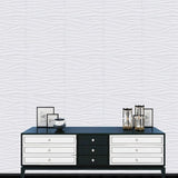 Lavic 3D wavy wall panels installed behind a modern black and white console table, adding texture and elegance to interior decor.