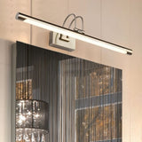 "A silver wall lamp with a linear LED bar mounted above a modern bathroom mirror with a dark abstract pattern."