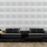 Modern living room with Lberin Wall Panels in white PVC, creating a textured accent wall with repeating floral patterns.