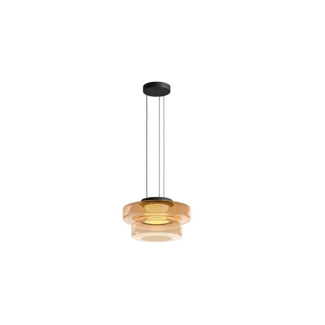 "An amber glass disc pendant light with tiered design."