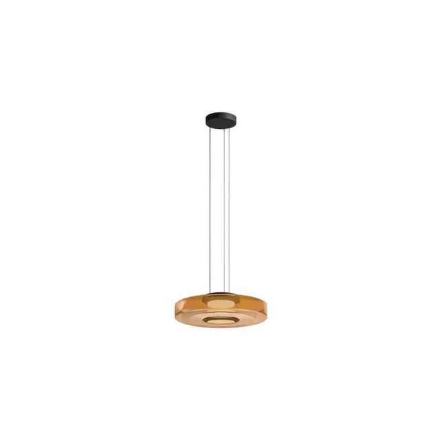 "A single amber glass disc pendant light."