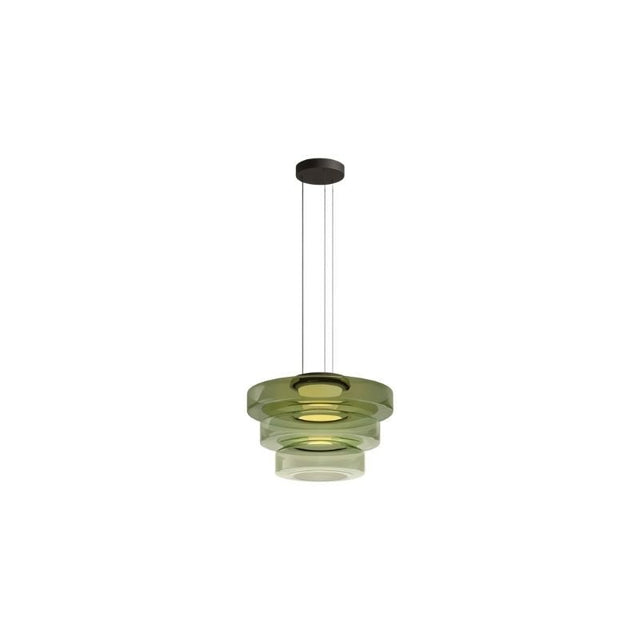 "A green glass disc pendant light with tiered design."