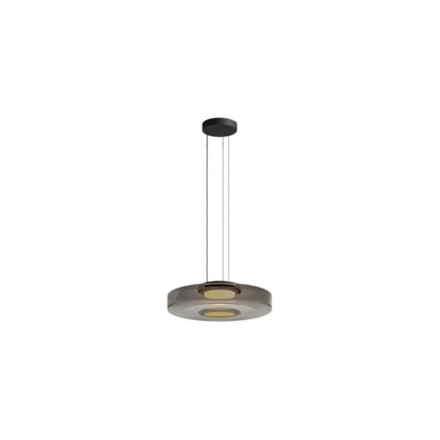 "A single grey glass disc pendant light."