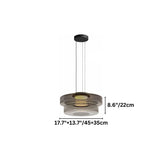 "A small glass disc pendant light showing product dimensions."