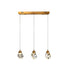 Three-light brass pendant fixture with faceted crystal glass shades hanging from adjustable cords against white background.