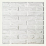 Close-up of a single Libtu Wall Panel with 3D white brick pattern, ideal for DIY PVC wall panel installations.