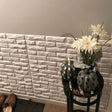 Decorative hallway featuring Libtu Wall Panel with white 3D brick texture, enhancing interior style with PVC wall panels.