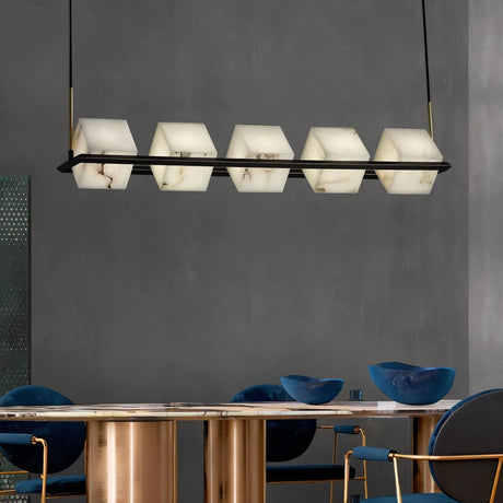 Five-light pendant chandelier with black metal frame and white alabaster shades, suspended above a dining table.