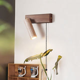 "Lindr bedside wall lamp in a reading corner, crafted from travertine and walnut, with a pull chain for easy light control."