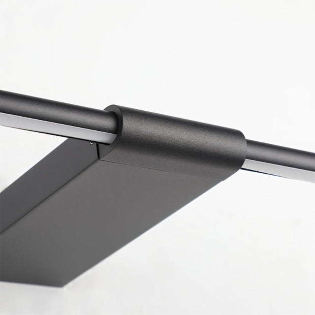 "Close-up detail of the black metal and PC construction of the Lisorva wall lamp, highlighting its minimalist design and functionality."