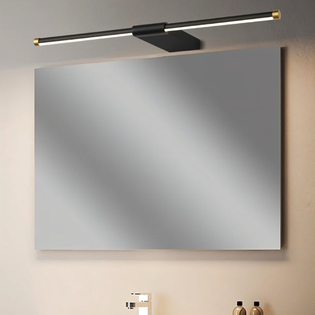 "Modern and minimalist Lisorva wall lamp in black metal and PC with brass accents, providing even illumination above a bathroom vanity."