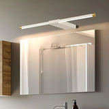 "Modern white Lisorva wall lamp, crafted from metal and PC with brass accents, providing even illumination above a bathroom vanity mirror."