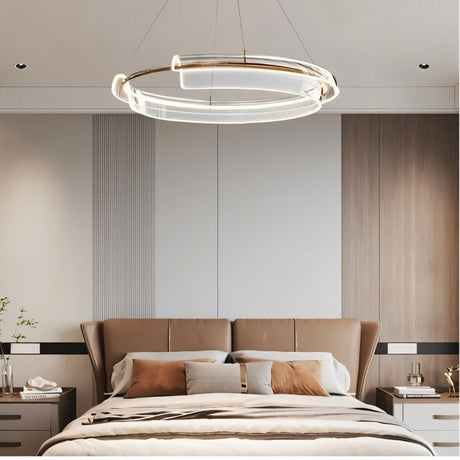 "An asymmetric dual-ring LED chandelier with iron and acrylic in a modern bedroom."