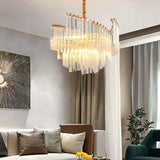 "A modern tiered chandelier with clear crystal rods, illuminating a contemporary living room with soft light."