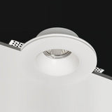 "Close-up of Loux Trimless Downlight, featuring a minimalist design made of gypsum and aluminum, seamlessly integrated into the ceiling for a clean, unobtrusive look."