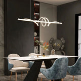 "A modern white linear pendant light with wave-like curves, hanging above a dining table in a modern dining room with art."