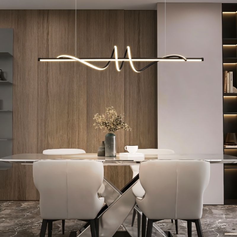 "A modern black linear pendant light with wave-like curves, hanging above a dining table in a modern dining room with a decorative wall."