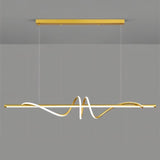 "A modern gold linear pendant light with wave-like curves, suspended against a gray background."