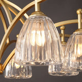 "Close-up of a gold chandelier with textured glass shades."