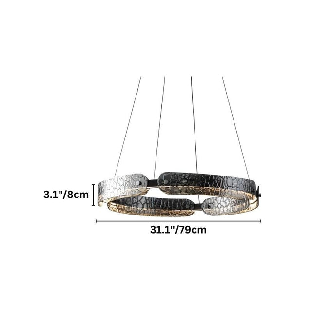 "A circular, segmented chandelier with a ring design and textured pattern, made of iron and glass, suspended by thin cables."