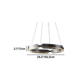 "A smaller, circular, segmented chandelier with a ring design and textured pattern, made of iron and glass, suspended by thin cables."