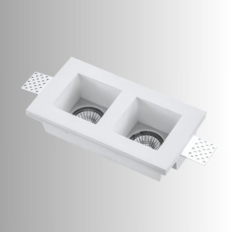 "Trimless recessed downlight fixture with dual square openings, crafted from gypsum and aluminum, offering a sleek and minimalist design for focused, efficient lighting."