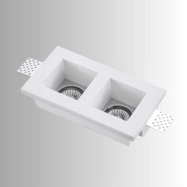 "Trimless recessed downlight fixture with dual square openings, crafted from gypsum and aluminum, offering a sleek and minimalist design for focused, efficient lighting."