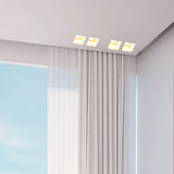 "Trimless recessed downlights made from gypsum and aluminum, seamlessly integrated into the ceiling of a modern living space, providing efficient and focused illumination."
