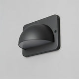 "A modern, dome-shaped outdoor wall lamp with a square base and PC diffuser, mounted on a light gray wall."