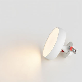 "The Maiko downlight with a sleek aluminum finish offers soft, ambient lighting. Its minimalist style blends perfectly with contemporary interiors, enhancing the overall aesthetic."