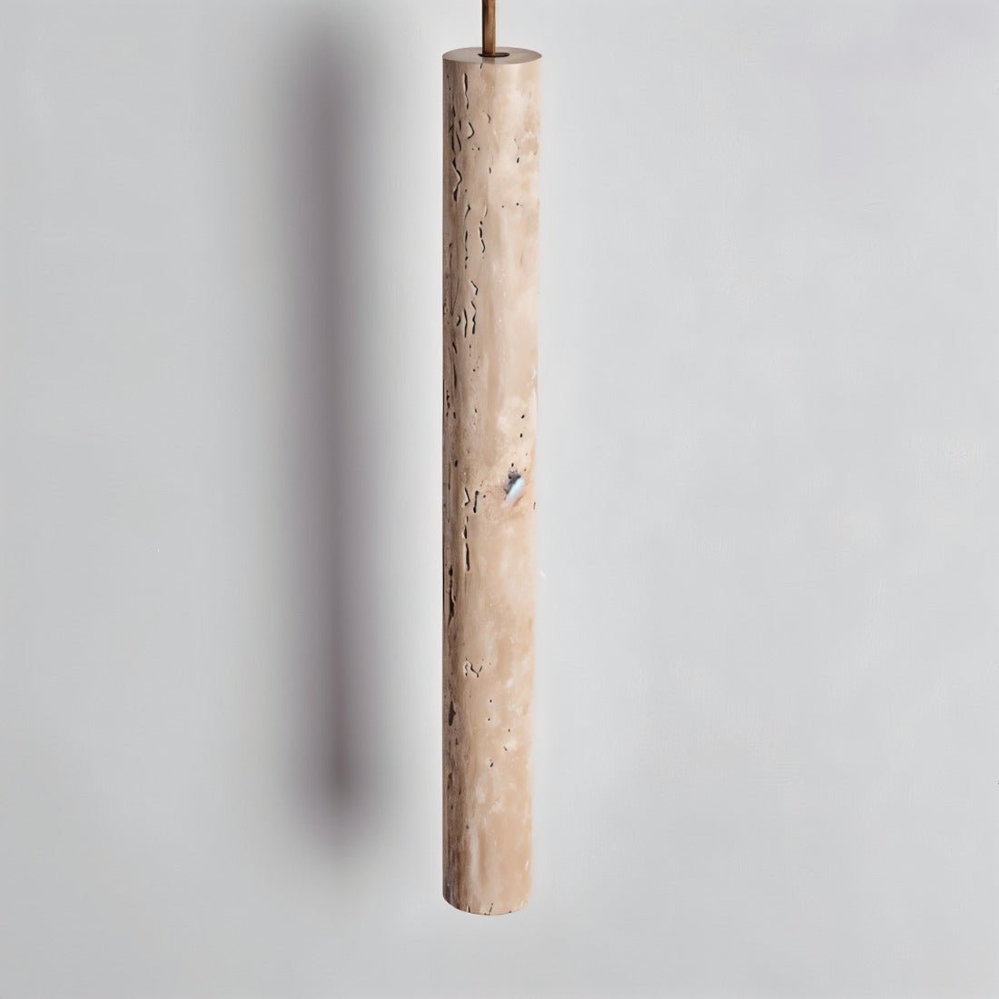 Close-up of Marus Pendant Light - Open Box | Sleek Travertine Fixture showing natural stone texture and cylindrical shape.