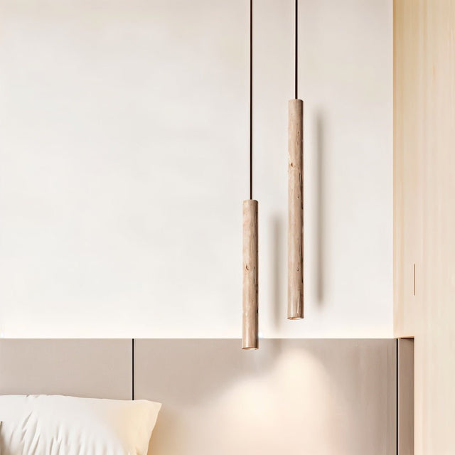 Marus Pendant Light - Open Box | Sleek Travertine Fixture hanging beside a bed, ideal for soft bedroom lighting in Wabi-Sabi interiors.