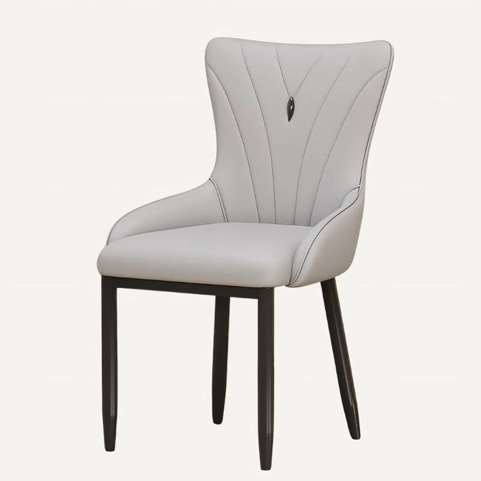 Mazon Velvet Tufted Dining Chair: Upholstered in plush velvet with elegant tufted detailing, this dining chair exudes sophistication and adds a luxurious touch to formal dining rooms.