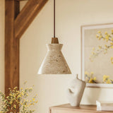 Menra Pendant Light in a rustic interior setting, showcasing its natural stone and wood design for warm, ambient lighting.