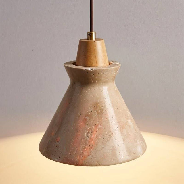 Detailed view of Menra Pendant Light showing polished travertine surface and wood accent, emitting soft ambient light.