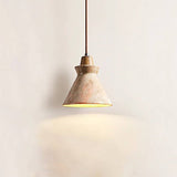 Menra Pendant Light casting warm glow, crafted from natural stone and wood, ideal for modern or Wabi-Sabi inspired interiors.