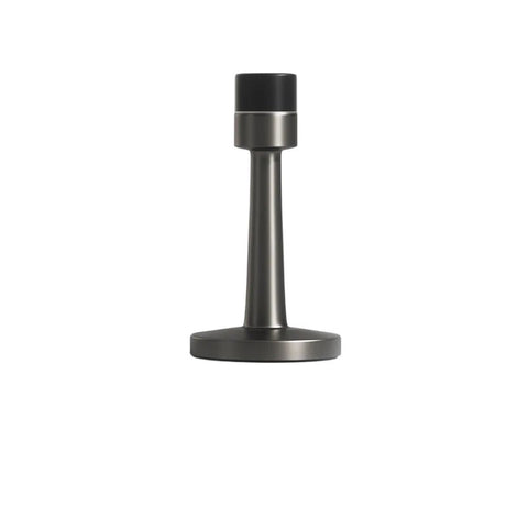 "Sleek, cylindrical zinc-alloy door stop with a sturdy wall-mounted base and extended arm to prevent doors from hitting walls in modern interiors."