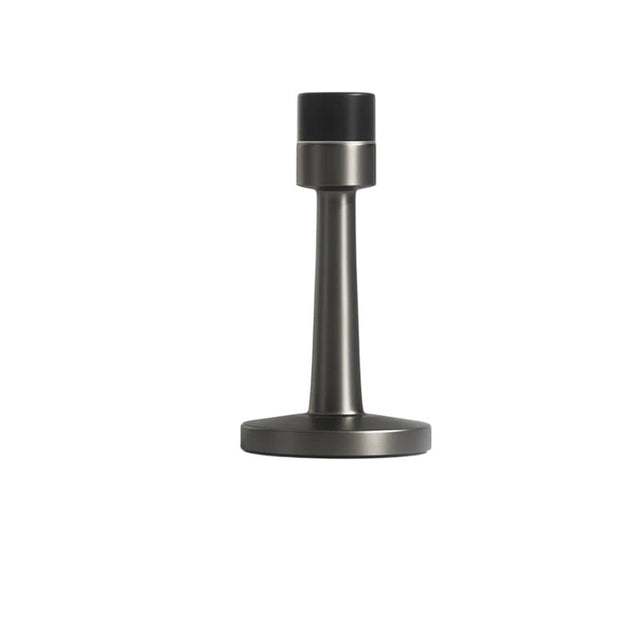 "Sleek, cylindrical zinc-alloy door stop with a sturdy wall-mounted base and extended arm to prevent doors from hitting walls in modern interiors."