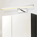 "Modern bathroom featuring a Mirvia Wall Lamp above a mirror, complemented by a cabinet, showcasing sleek design and LED efficiency."