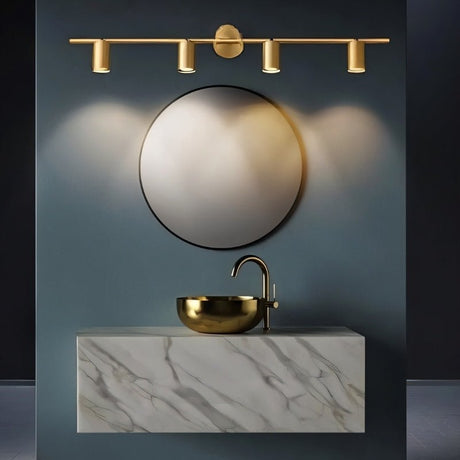 "Modern brass bathroom vanity lighting with four adjustable heads mounted on a circular base above a round mirror in a contemporary bathroom."