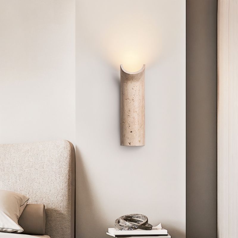 "Contemporary marble wall lamp featuring a minimalist curved design, providing a soft, ambient light."