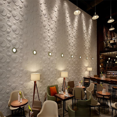 Mundi Wall Panel installed in a modern cafe interior, featuring 3D circular PVC wall panels that enhance the ambiance with stylish texture.