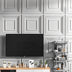 Musna PVC wall panels in a modern living room with mounted TV and shelf, offering a stylish and easy DIY wall upgrade solution.