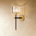Two-light wall sconce with cylindrical pleated shades, polished nickel finish, shown front and side views with dimensions on