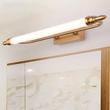 "A vintage-inspired LED wall lamp mounted above a bathroom cabinet with a mirror panel."