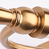 "A close-up view of the Nalsi LED wall lamp's end detail, showcasing its warm metallic finish and design."