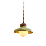"Handcrafted pendant light with a curved ceramic shade and wooden top, blending vintage and modern aesthetics."