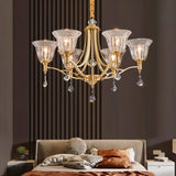 "Elegant chandelier with an iron frame, curved arms, glass shades, and crystal accents hangs in a bedroom, adding a touch of classic luxury."
